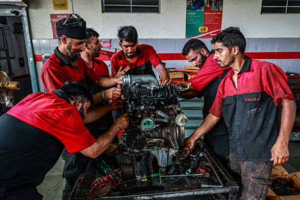 gettyimages-2166314137-612x612 Mechanics are repairing an engine at a Mahindra vehicle showroom in Baramulla, Jammu and Kashmir, India, on August 13, 2024. (Photo by Nasir Kachroo/NurPhoto via Getty Images)