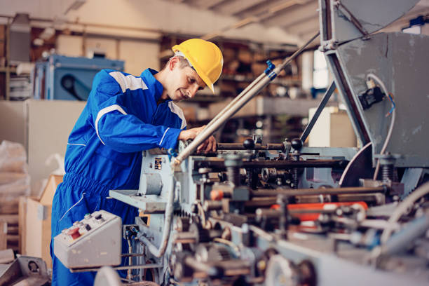 gettyimages-685688410-612x612 Maintenance engineer or blue collar worker working in production factory, testing and repairing machines, testing roll bars and using grinder or drill.